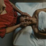 A woman enjoying a relaxing massage therapy session at a spa, promoting wellness and relaxation.