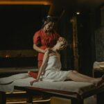 A serene spa massage session with a therapist providing a calming treatment indoors.