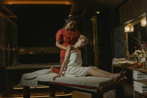 A serene spa massage session with a therapist providing a calming treatment indoors.